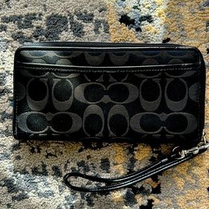 Barely used beautiful black monogram Coach wallet (checkbook size).